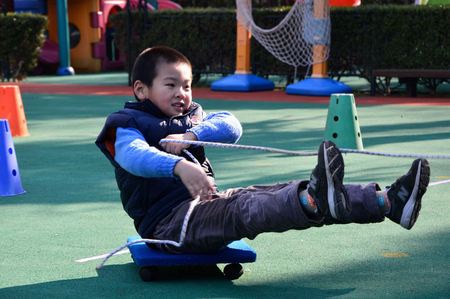 Shanghai kindergarten kids enjoy the warm winter sun to participate in outdoor activitiesのeditorial素材