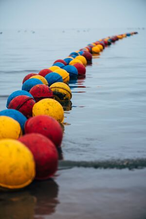 a buoy that extends deep into the seaの写真素材