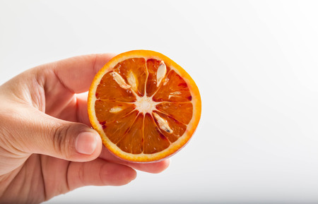 On the palm of orangesの写真素材