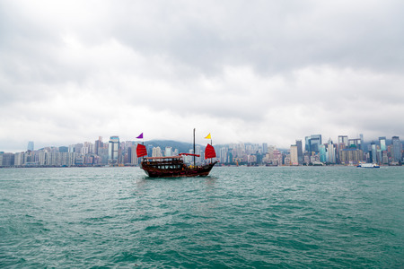 Hong Kong harbour with tourist junkの写真素材