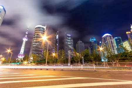 the light trails on the modern building background in shanghai china.