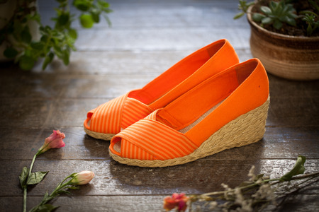 Close up view of a pair of orange wedgesの写真素材