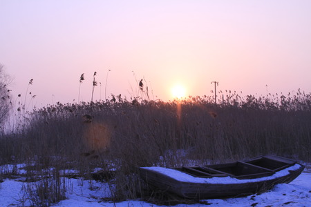 The setting sun in winterの写真素材