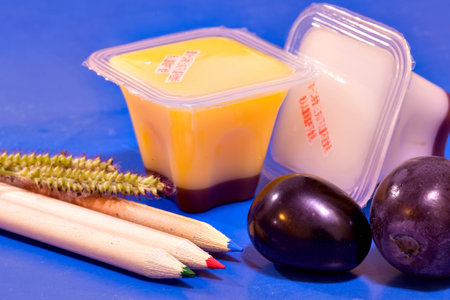 Grape, jelly and pencil on tableの写真素材