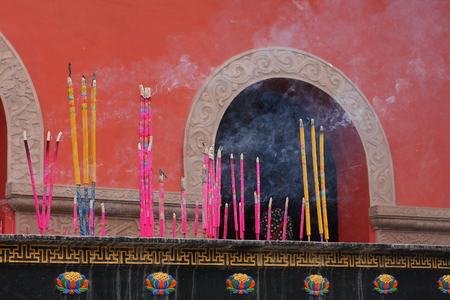 Buddhist prayer joss sticks in a chinese templeの写真素材