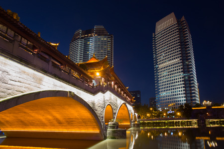 Night view of beautiful Anshun Bridge above Jinjiang river, and downtown of Jiuyanqiao in the blue hour, Chengdu, Sichuan, Chinaのeditorial素材