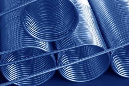 stacked copper spiral parts in a warehouse, in a manufacturing factoryの写真素材