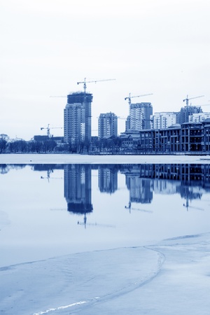 unfinished building at the side of riverの写真素材