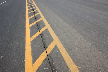 yellow double solid line on the roadの写真素材