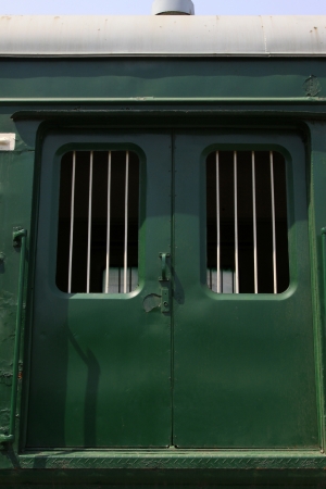 closeup of green train cars in a stationの写真素材
