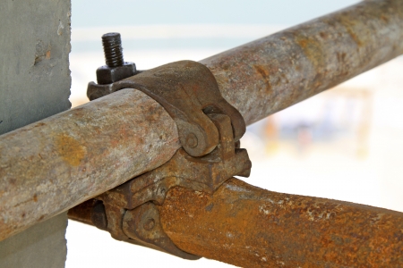 rusty metal scaffolding elements, closeup shot の写真素材
