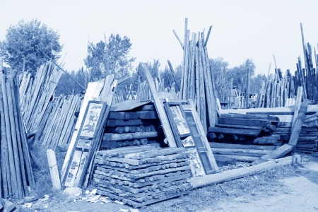 waste wood stacked together in a marketのeditorial素材