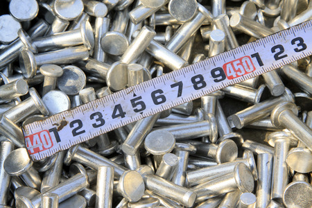 new rivet and tape measure piled up together の写真素材