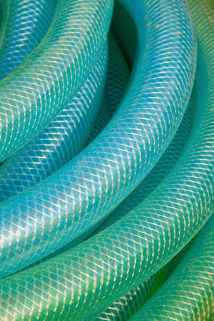 blue plastic pipe stacked toghter at a construction site の写真素材