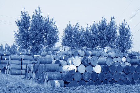 oil drums stacked together in a yard, north chinaのeditorial素材