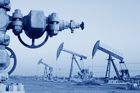 CAOFEIDIAN - DECEMBER 1: The crank balanced beam pumping unit and all kinds of valve in the JiDong oilfield, on December 1, 2013, caofeidian, hebei province, China. のeditorial素材