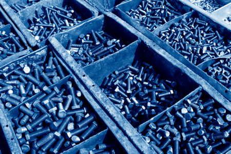 closeup of metal parts, a lot of bolt in iron box 