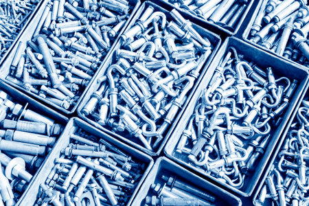 piles of expansion bolts in the iron box 