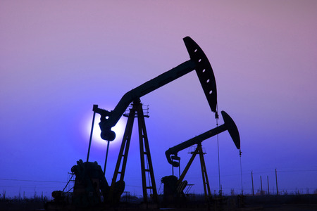 CAOFEIDIAN - DECEMBER 1: The crank balanced beam pumping unit under the curtain of night in the JiDong oilfield, on December 1, 2013, caofeidian, hebei province, China. 
のeditorial素材