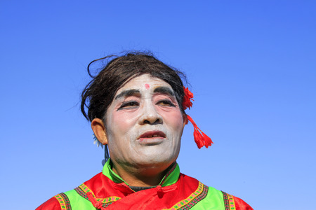 LUANNAN COUNTY - FEBRUARY 10: Buffoon wearing colorful clothes, performing yangko dance in the street, during the Chinese Lunar New Year, February 10, 2014, Luannan County, Hebei Province, China.
のeditorial素材