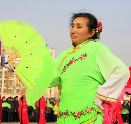 LUANNAN COUNTY - FEBRUARY 11: People wearing colorful clothes, performing yangko dance in the street, during the Chinese Lunar New Year, February 11, 2014, Luannan County, Hebei Province, China.
のeditorial素材