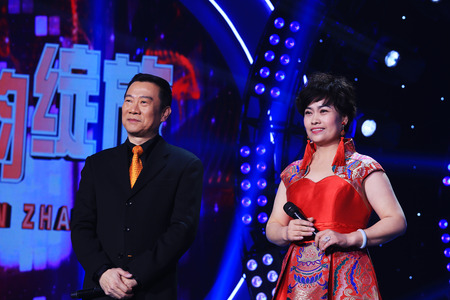 LUANNAN COUNTY - JANUARY 3: The CCTV opera channel host Zhao Baole and competitors on the stage, in the ChengZhaoCai grand theater, January 3, 2014,luannan county, hebei province, china.のeditorial素材