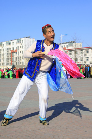 LUANNAN COUNTY - FEBRUARY 10: People wearing colorful clothes, performing yangko dance in the street, during the Chinese Lunar New Year, February 10, 2014, Luannan County, Hebei Province, China.
のeditorial素材