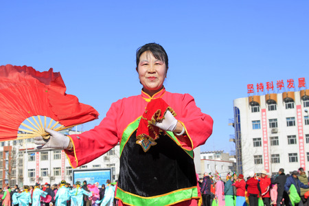 LUANNAN COUNTY - FEBRUARY 9: Woman holding pairs of wooden stick performing yangko dance in the street, during the Chinese Lunar New Year, February 9, 2014, Luannan County, Hebei Province, China.
のeditorial素材