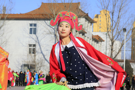 LUANNAN COUNTY - FEBRUARY 9: Girl wearing colorful clothes, performing yangko dance in the street, during the Chinese Lunar New Year, February 9, 2014, Luannan County, Hebei Province, China.
のeditorial素材
