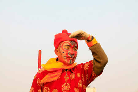 LUANNAN COUNTY - FEBRUARY 13: Sun wukong's image wearing colorful clothes, performing yangko dance...