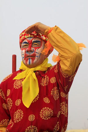 LUANNAN COUNTY - FEBRUARY 15: Sun wukong's image wearing colorful clothes, performing yangko dance in the street, during the Chinese Lunar New Year, February 15, 2014, Luannan County, Hebei Province, China.のeditorial素材