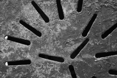 closeup of perforated plate in a factoryの写真素材