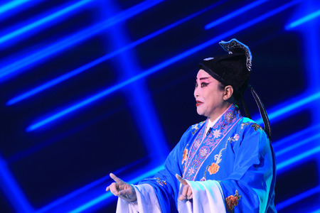 LUANNAN COUNTY - JANUARY 7: The childe cap performers in on the PingJu stage, in the ChengZhaoCai grand theater, January 7, 2014,luannan county, hebei province, china. のeditorial素材