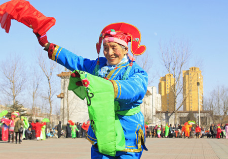 LUANNAN COUNTY - FEBRUARY 9: People wearing colorful clothes, performing yangko dance in the street, during the Chinese Lunar New Year, February 9, 2014, Luannan County, Hebei Province, China.
のeditorial素材