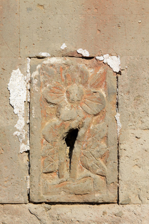 carve patterns on the gray walls, closeup of photoの写真素材