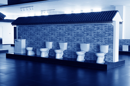 Ceramic toilet display in a hall, closeup of photoのeditorial素材