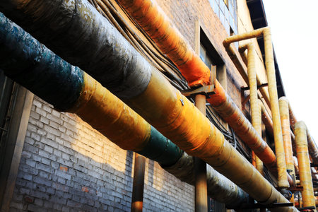 material pipe wrapped in thermal insulation in a factoryの写真素材