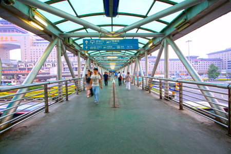 Pedestrians on the flyover near the Beijing west railway station, Beijing, Chinaのeditorial素材