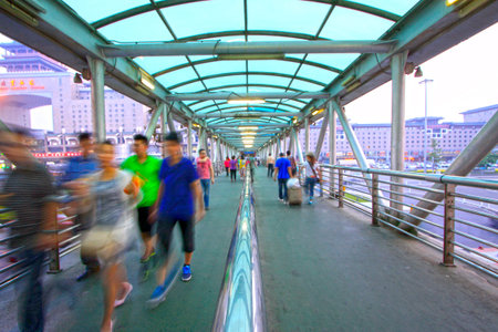 Pedestrians on the flyover near the Beijing west railway station, Beijing, Chinaのeditorial素材
