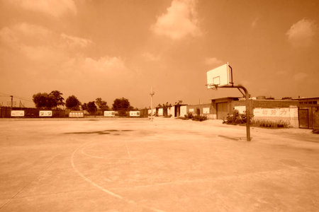 LUANNAN COUNTY - AUGUST 15: basketball frame on the playground in a rural school, on august 15, 2014, Luannan County, Hebei Province, China のeditorial素材