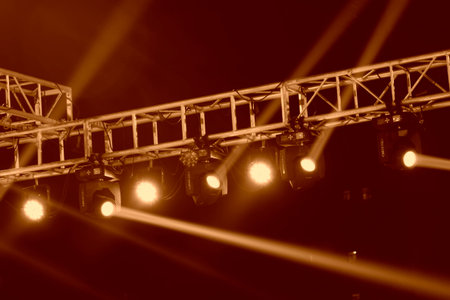 stage light on the metal frame in the dark 