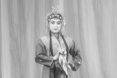 LUANNAN COUNTY - NOVEMBER 25: The ancient costume PingJu " QianKun-Fu-Shou Mirror" still in the ChengZhaoCai grand theater, on november 28, 2013, luannan county, hebei province, china.のeditorial素材