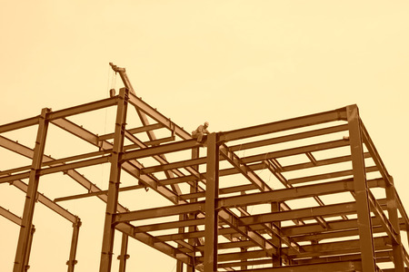 LUANNAN COUNTY -  AUGUST 16: Workers installing steel frame in a factory, on august 16, 2014, Luannan County, Hebei Province, China のeditorial素材