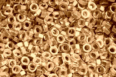 screw nut piled up together, closeup of photoの写真素材