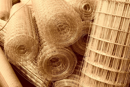 iron wire fence texture in a warehouse, closeup of photoの写真素材