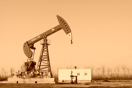 CAOFEIDIAN - DECEMBER 1: The crank balanced beam pumping unit in the JiDong oilfield, on December 1, 2013, caofeidian, hebei province, China.のeditorial素材