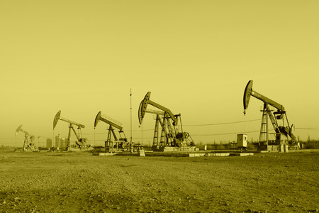 CAOFEIDIAN - DECEMBER 1: The crank balanced beam pumping unit in the JiDong oilfield, on December 1, 2013, caofeidian, hebei province, China.のeditorial素材