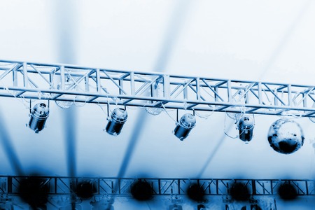 stage light on the metal frame in the darkの写真素材