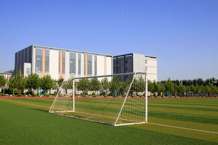 LUANNAN COUNTY - SEPTEMBER 3: football field and teaching building in a school, on september 3, 2014, Luannan County, Hebei Province, Chinaのeditorial素材
