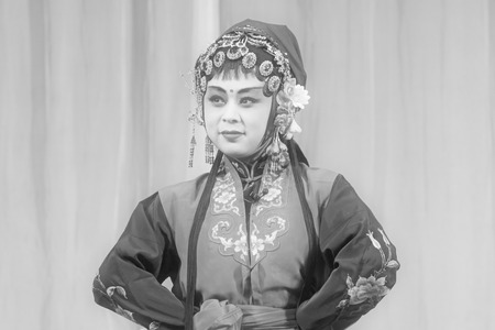 LUANNAN COUNTY - NOVEMBER 25: The ancient costume PingJu " QianKun-Fu-Shou Mirror" still in the ChengZhaoCai grand theater, on november 28, 2013, luannan county, hebei province, china.のeditorial素材